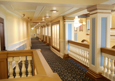 A look down the second level corridor of the Performing Arts Center of the Catholic Private School.